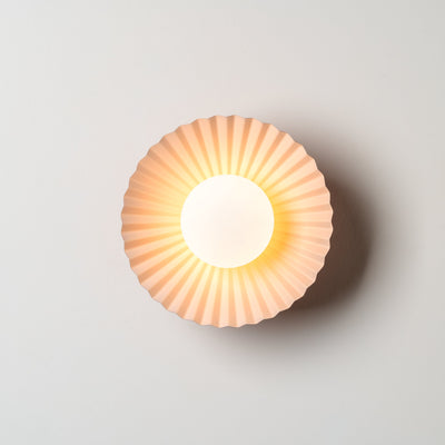 Houseof Pleat Wall and Flush Ceiling Lamp designed by Emma Gurner, light on front view. Available from someday designs.