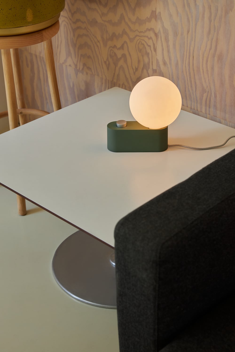 Tala Alumina Lamp as a table light switched on lifestyle image. Free + fast UK delivery from someday designs. #colour_sage