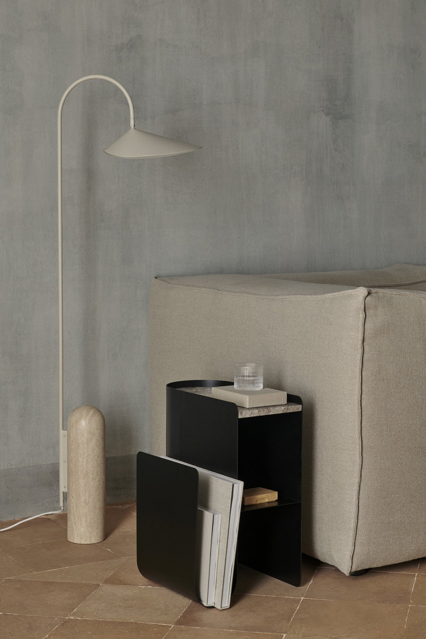 vault side table by ferm LIVING lifestyle image with Arum floor lamp and Catena sofa #colour_black