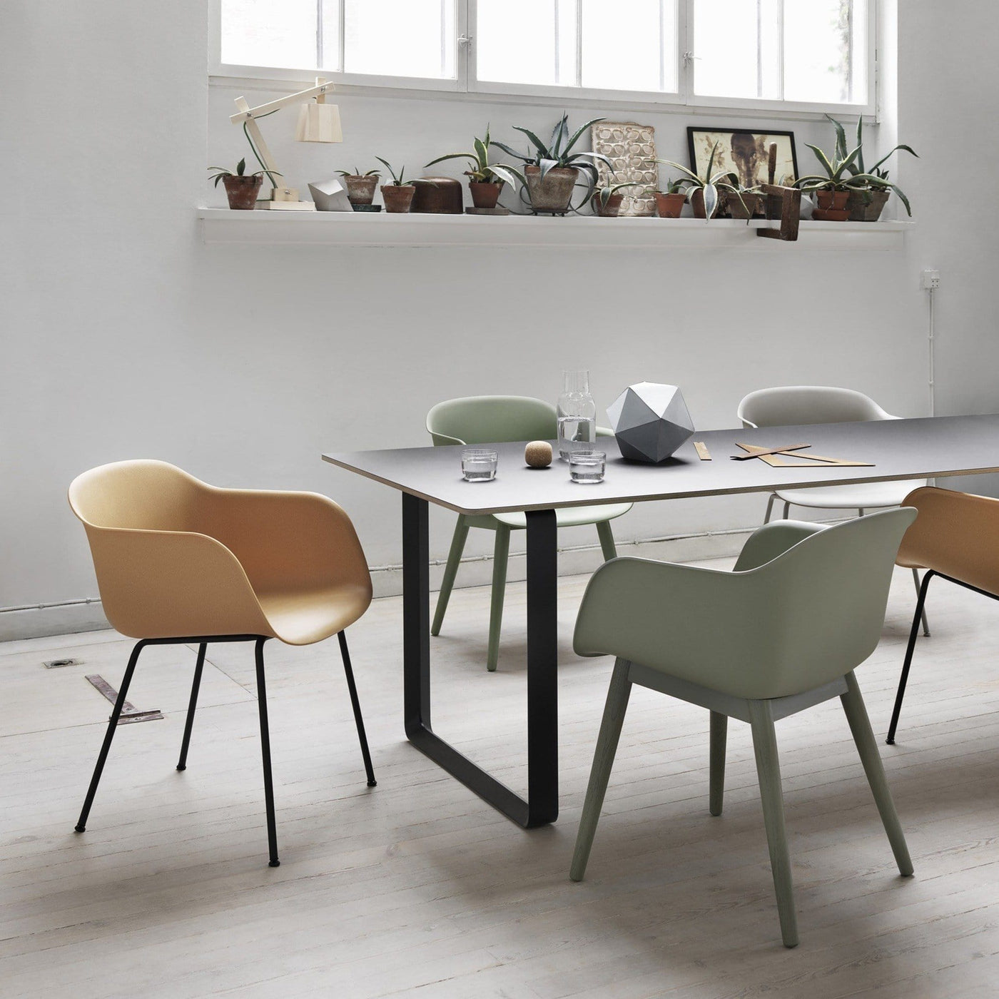 muuto fiber armchair tube base in a dining room setting, available at someday designs. #colour_ochre
