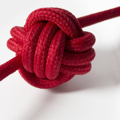 Detailed, close up shot of red fabric cable used on small knot lamp by Vitamin