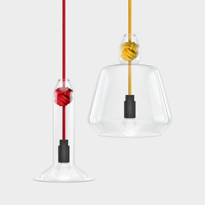 Knot Lamp is made from handblown glass with two shade designs, both supported by a monkey fist knot in a choice of 6 colours.  Pictured here with small shade with red fabric cord and large shade with yellow fabric cord.  Beautiful, simple and versatile lighting.