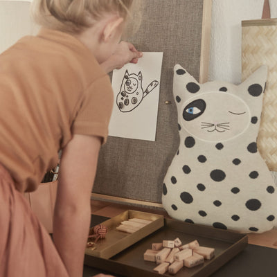 the cool cat zorro cushion by OYOY has a stylish monochrome spotty print and distinctive eye detailing.