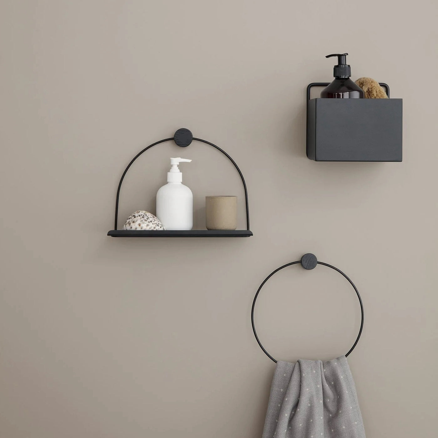 Minimal bathroom with black towel holder from Ferm Living