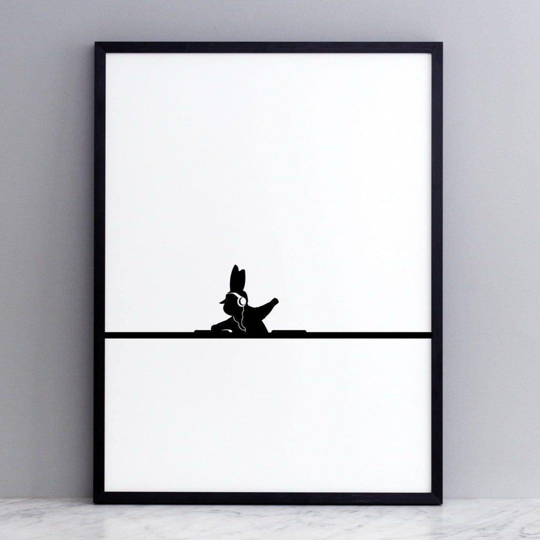 black and white image of HAM rabbit mixing records.  Fun and playful series of prints.  Ideal for adults and children. Pictured here on marble surface with grey painted wall backdrop.
